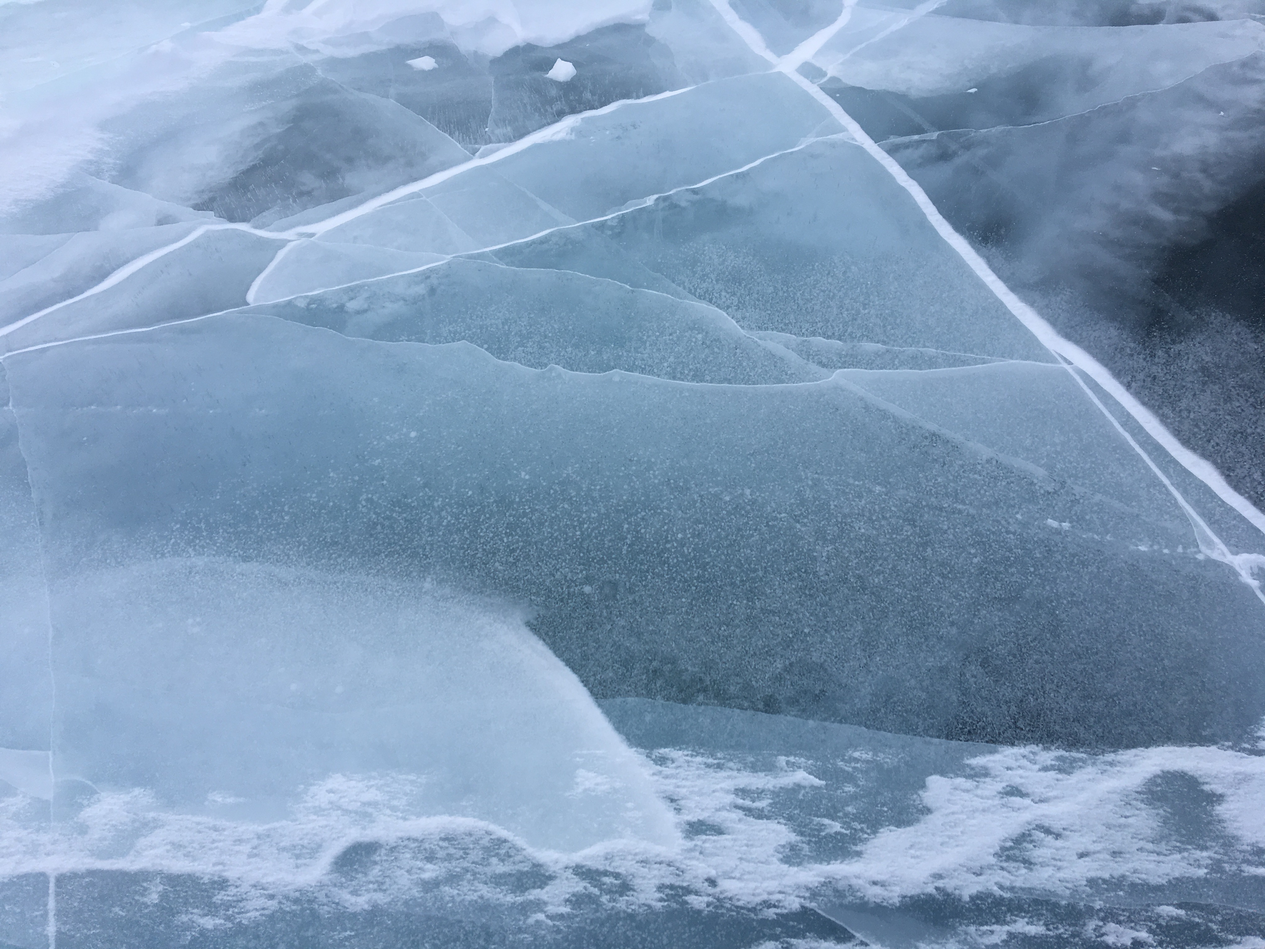 Closeup of the frozen lake, uncovered by intense wind.
